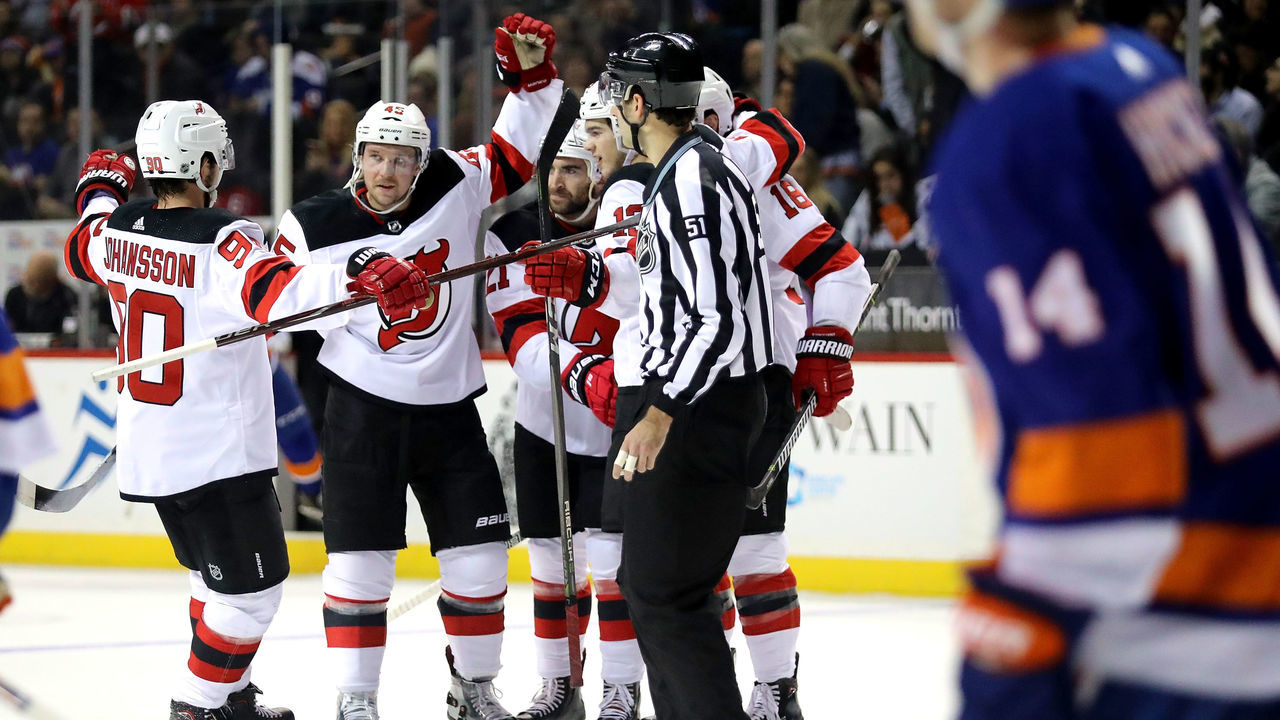 NEW YORK, NY - JANUARY 16: The New Jersey Devils celebrate a goal by Kyle Palmieri #21 of the New Jersey Devils in the first period against the New York Islanders during their game at Barclays Center on January 16, 2018 in the Brooklyn borough of New York City.