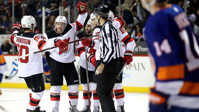 NEW YORK, NY - JANUARY 16: The New Jersey Devils celebrate a goal by Kyle Palmieri #21 of the New Jersey Devils in the first period against the New York Islanders during their game at Barclays Center on January 16, 2018 in the Brooklyn borough of New York City.