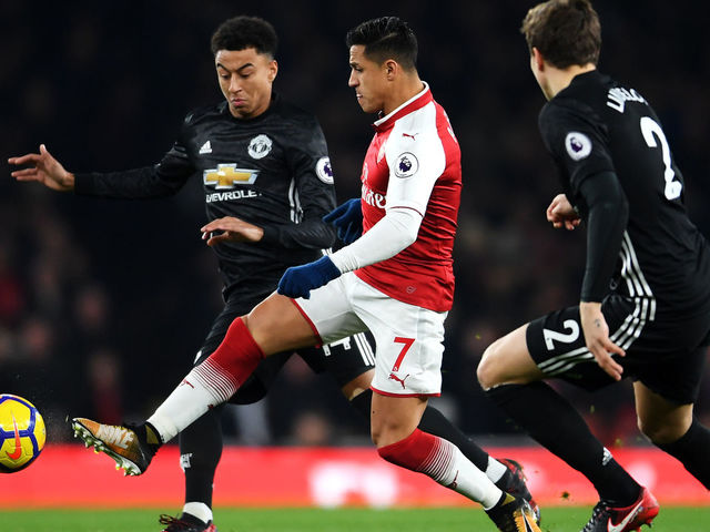 LONDON, ENGLAND - DECEMBER 02: Alexis Sanchez of Arsenal is challenged by Jesse Lingard of Manchester United during the Premier League match between Arsenal and Manchester United at Emirates Stadium on December 2, 2017 in London, England.