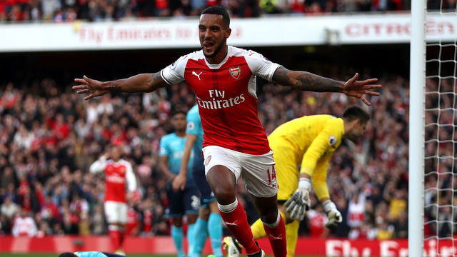 LONDON, ENGLAND - OCTOBER 15: Theo Walcott of Arsenal celebrates scoring his sides first goal during the Premier League match between Arsenal and Swansea City at Emirates Stadium on October 15, 2016 in London, England.