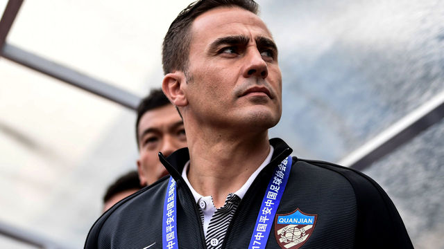 Tianjin Quanjian's head coach Fabio Cannavaro looks on before the Chinese Super League match against Guangzhou R&F in Guangzhou, south China's Guangdong province on March 4, 2017. / AFP PHOTO / STR / CHINA OUT