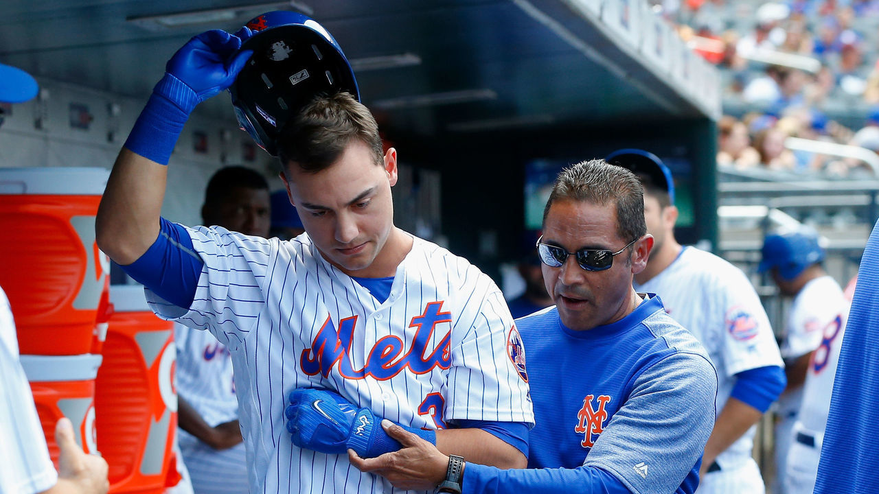 NEW YORK, NY - AUGUST 24: Michael Conforto #30 of the New York Mets leaves a game against the Arizona Diamondbacks with trainer Ray Ramirez after an injury during an at-bat in the fifth inning at Citi Field on August 24, 2017 in the Flushing neighborhood of the Queens borough of New York City.