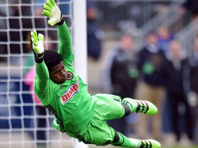 CHESTER, PA - MARCH 20: Goalkeeper Andre Blake #1 of Philadelphia Union dives to make a save as the ball get past him and bounces off the post against the New England Revolution at Talen Energy Stadium on March 20, 2016 in Chester, Pennsylvania.
