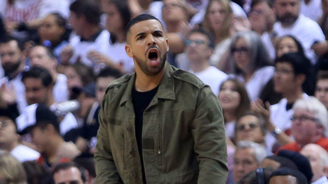 TORONTO, ON - MAY 23: Rapper Drake reacts in the first quarter of game four of the Eastern Conference Finals between the Toronto Raptors and the Cleveland Cavaliers during the 2016 NBA Playoffs at the Air Canada Centre on May 23, 2016 in Toronto, Ontario, Canada.
