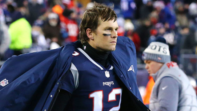 FOXBOROUGH, MA - JANUARY 13: Tom Brady #12 of the New England Patriots looks on from the bench during the AFC Divisional Playoff game against the Tennessee Titans at Gillette Stadium on January 13, 2018 in Foxborough, Massachusetts.