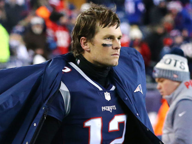 FOXBOROUGH, MA - JANUARY 13: Tom Brady #12 of the New England Patriots looks on from the bench during the AFC Divisional Playoff game against the Tennessee Titans at Gillette Stadium on January 13, 2018 in Foxborough, Massachusetts.