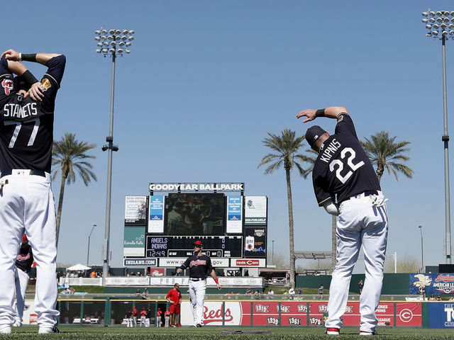 GOODYEAR, AZ - MARCH 09: Jason Kipnis #22 of the Cleveland Indians and Eric Stamets #77 stretch out before the spring training game against the Los Angeles Angels of Anaheim at Goodyear Ballpark on March 9, 2017 in Goodyear, Arizona.