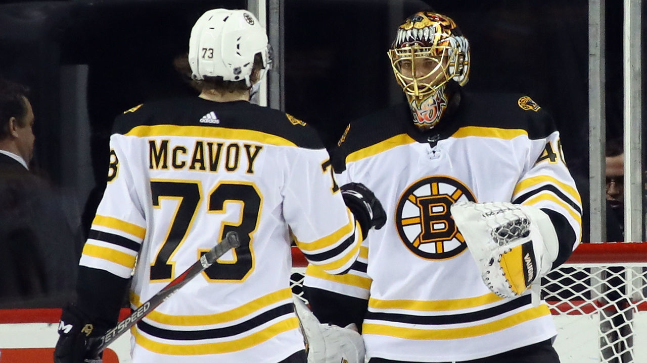 NEW YORK, NY - JANUARY 02: Charlie McAvoy #73 and Tuukka Rask #40 of the Boston Bruins celebrate a 5-1 victory over the New York Islanders at the Barclays Center on January 2, 2018 in the Brooklyn borough of New York City.