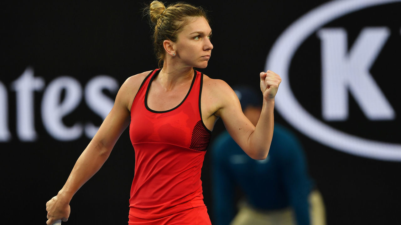 Romania's Simona Halep reacts against Canada's Eugenie Bouchard during their women's singles second round match on day four of the Australian Open tennis tournament in Melbourne on January 18, 2018. / AFP PHOTO / Paul Crock / -- IMAGE RESTRICTED TO EDITORIAL USE - STRICTLY NO COMMERCIAL USE --