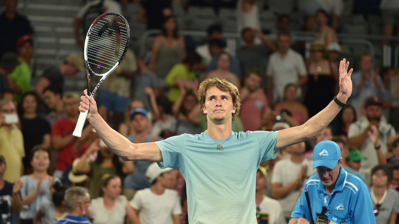 Germany's Alexander Zverev celebrates beating Germany's Peter Gojowczyk in their men's singles second round match on day four of the Australian Open tennis tournament in Melbourne on January 18, 2018. / AFP PHOTO / PETER PARKS / -- IMAGE RESTRICTED TO EDITORIAL USE - STRICTLY NO COMMERCIAL USE --