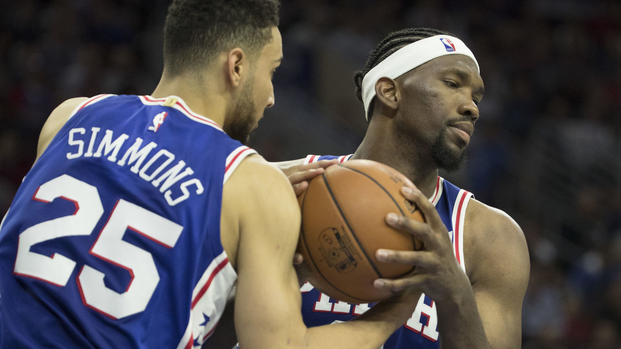PHILADELPHIA, PA - OCTOBER 20: Ben Simmons #25 and Joel Embiid #21 of the Philadelphia 76ers grab a rebound against the Boston Celtics at the Wells Fargo Center on October 20, 2017 in Philadelphia, Pennsylvania.