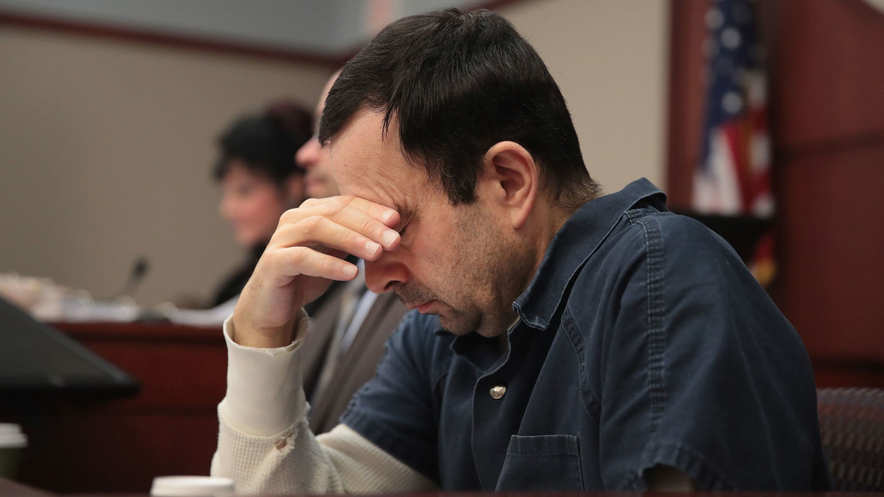 LANSING, MI - JANUARY 17: Larry Nassar listens to victim impact statements during his sentencing hearing after being accused of molesting more than 100 girls while he was a physician for USA Gymnastics and Michigan State University where he had his sports-medicine practice on January 17, 2018 in Lansing, Michigan. Nassar has pleaded guilty in Ingham County, Michigan, to sexually assaulting seven girls, but the judge is allowing all his accusers to speak. Nassar is currently serving a 60-year sentence in federal prison for possession of child pornography.