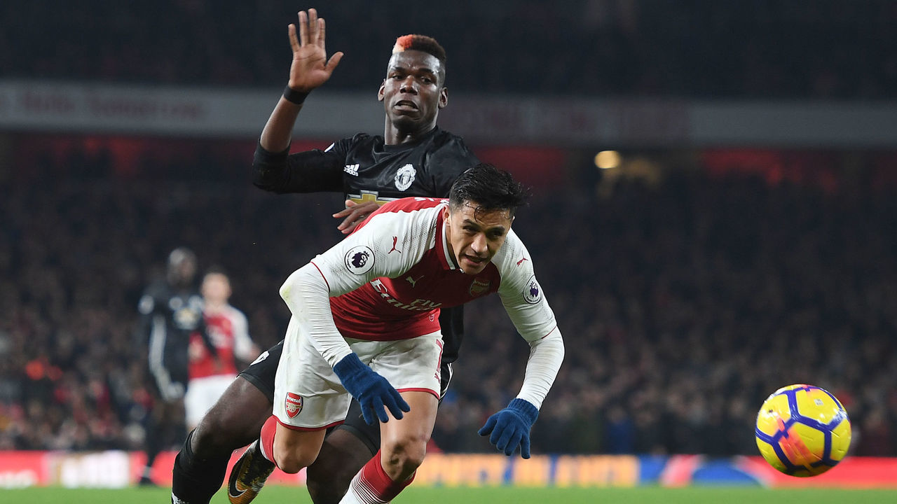 LONDON, ENGLAND - DECEMBER 02: Alexis Sanchez of Arsenal breaks past Paul Pogba of Man United during the Premier League match between Arsenal and Manchester United at Emirates Stadium on December 2, 2017 in London, England.