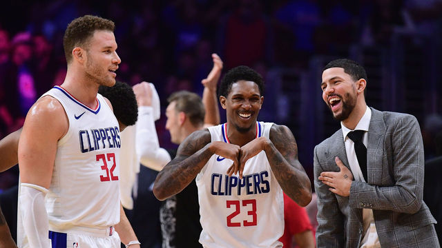 LOS ANGELES, CA - JANUARY 15: (R-L) Austin Rivers #25, Lou Williams #23 and Blake Griffin #32 of the LA Clippers laugh during a stop in play in a 113-102 Clipper win over the Houston Rockets at Staples Center on January 15, 2018 in Los Angeles, California.