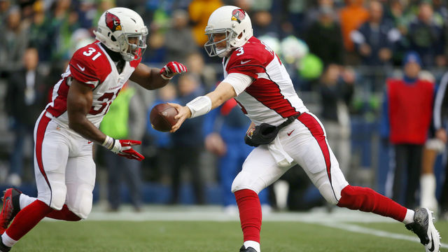 SEATTLE, WA - DECEMBER 24: Quarterback Carson Palmer #3 of the Arizona Cardinals hands off to running back David Johnson #31 against the Seattle Seahawks at CenturyLink Field on December 24, 2016 in Seattle,Washington.
