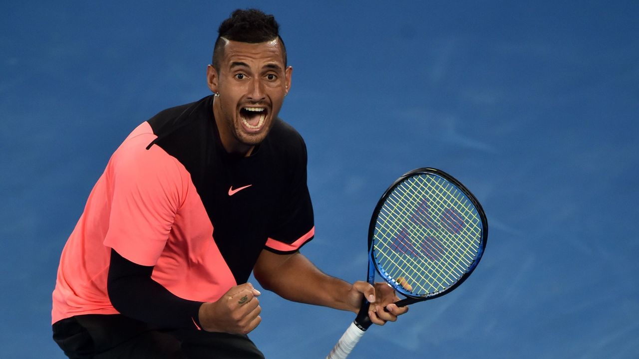 Australia's Nick Kyrgios celebrates after victory over France's Jo-Wilfried Tsonga during their men's singles third round match on day five of the Australian Open tennis tournament in Melbourne on January 19, 2018. / AFP PHOTO / PETER PARKS / -- IMAGE RESTRICTED TO EDITORIAL USE - STRICTLY NO COMMERCIAL USE --