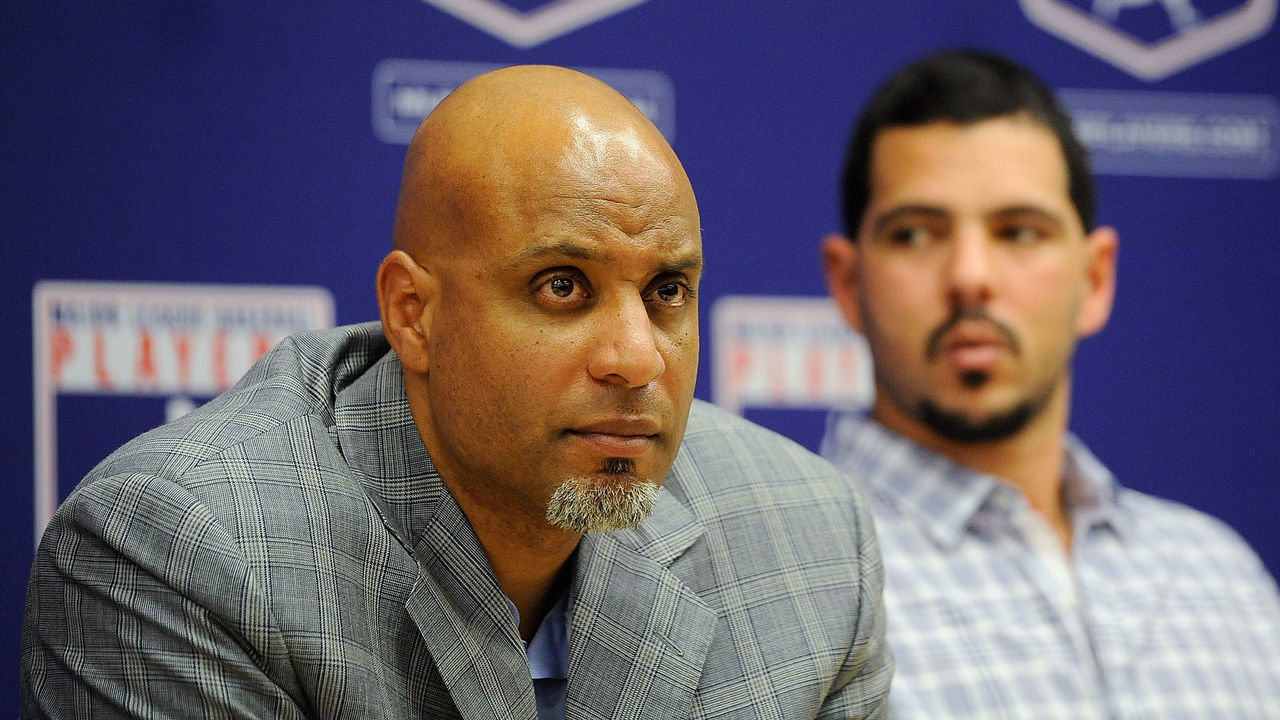 NEW YORK, NY - NOVEMBER 22: Tony Clark (L) and Carlos Villanueva listen as Major League Baseball Commissioner Bud Selig speaks at a news conference at MLB headquarters on November 22, 2011 in New York City. Selig announced a new five-year labor agreement between Major League Baseball and the Major League Baseball Players Association.