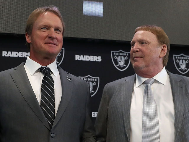 ALAMEDA, CA - JANUARY 09: Oakland Raiders new head coach Jon Gruden (L) and Raiders owner Mark Davis pose for a photograph during a news conference at Oakland Raiders headquarters on January 9, 2018 in Alameda, California. Jon Gruden has returned to the Oakland Raiders after leaving the team in 2001.