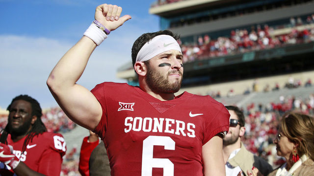 NORMAN, OK - NOVEMBER 25: Quarterback Baker Mayfield #6 of the Oklahoma Sooners gestures to the crowd after Senior Day announcements before the game against the West Virginia Mountaineers at Gaylord Family Oklahoma Memorial Stadium on November 25, 2017 in Norman, Oklahoma. Oklahoma defeated West Virginia 59-31.
