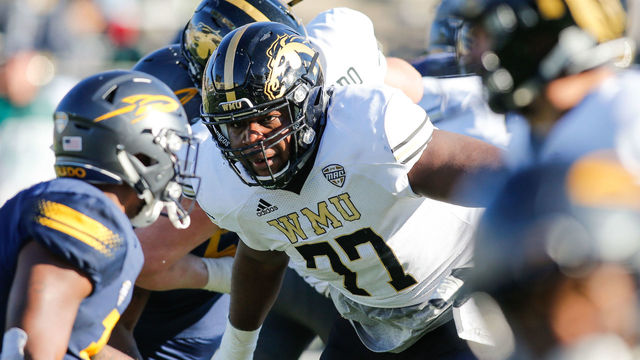 TOLEDO, OH - NOVEMBER 24: Western Michigan Broncos offensive lineman Chukwuma Okorafor (77) blocks during game action between the Western Michigan Broncos and the Toledo Rockets on November 24, 2017 at Glass Bowl Stadium in Toledo, Ohio. Toledo defeated Western Michigan 37-10 to advance to the MAC championship game.