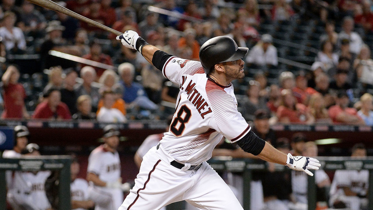 PHOENIX, AZ - SEPTEMBER 27: J.D. Martinez #28 of the Arizona Diamondbacks hits a solo home run in the ninth inning of the MLB game against the San Francisco Giants at Chase Field on September 27, 2017 in Phoenix, Arizona.