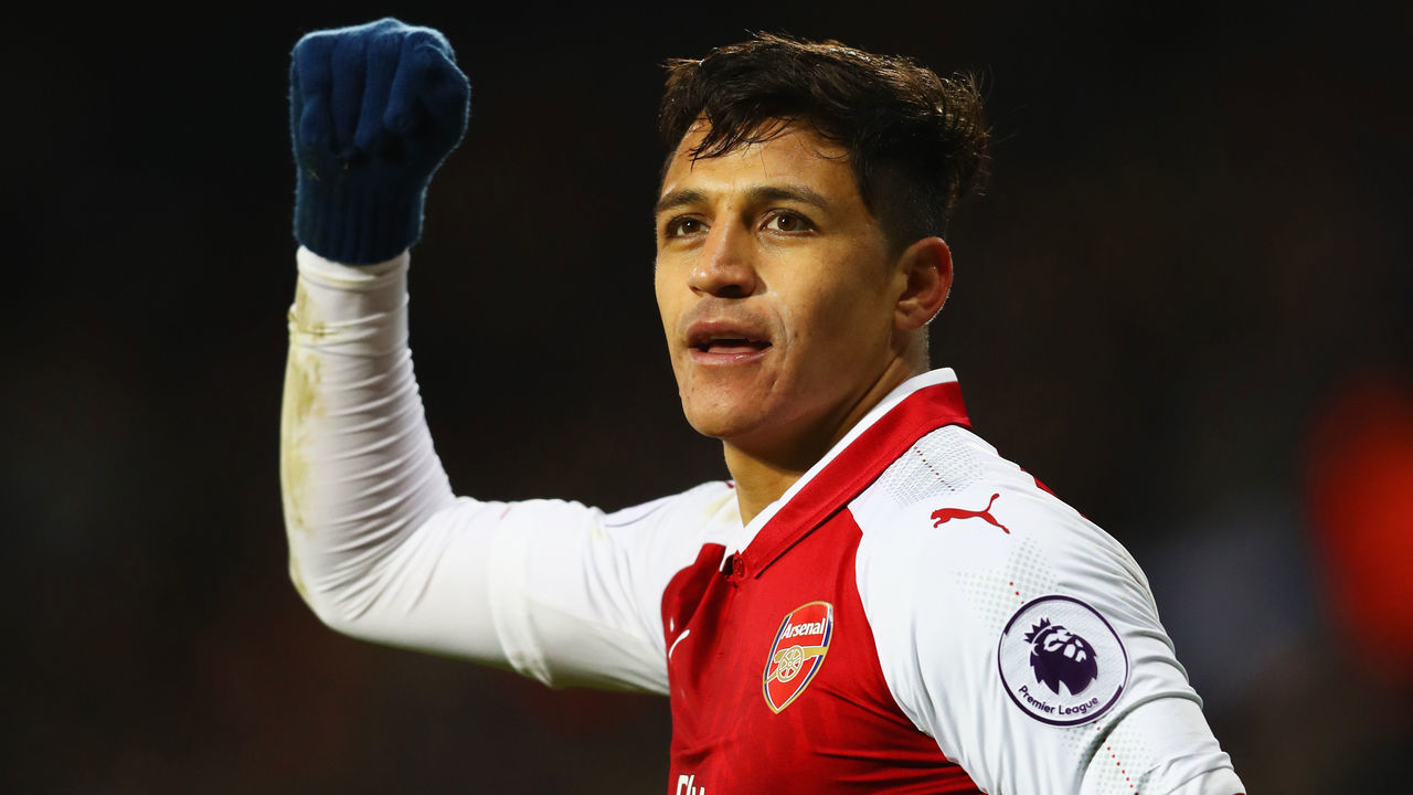 WEST BROMWICH, ENGLAND - DECEMBER 31: Alexis Sanchez of Arsenal celebrates as his free kick deflects off James McClean of West Bromwich Albion for their first goal during the Premier League match between West Bromwich Albion and Arsenal at The Hawthorns on December 31, 2017 in West Bromwich, England.