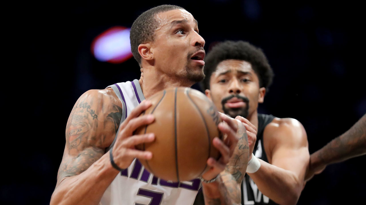 NEW YORK, NY - DECEMBER 20: George Hill #3 of the Sacramento Kings drives to the basket against Spencer Dinwiddie #8 of the Brooklyn Nets in the third quarter during their game at Barclays Center on December 20, 2017 in the Brooklyn Borough of New York City.