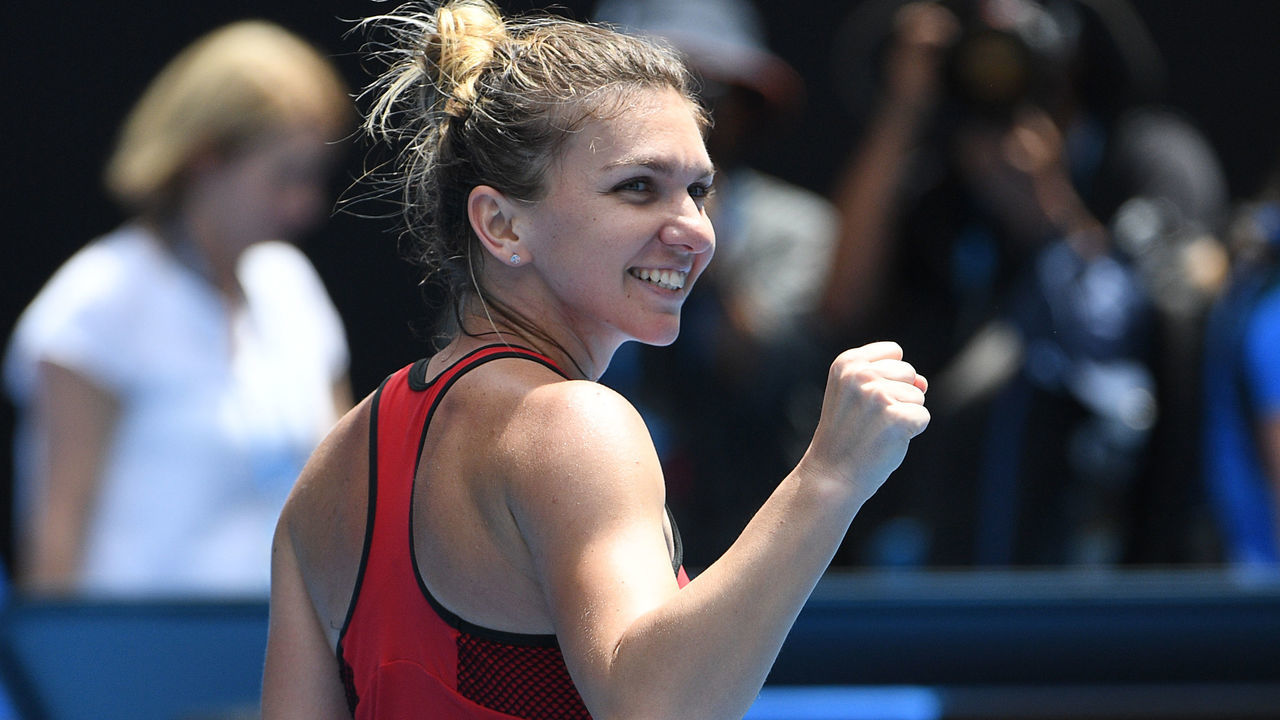 Romania's Simona Halep celebrates beating Lauren Davis of the US in their women's singles third round match on day six of the Australian Open tennis tournament in Melbourne on January 20, 2018. / AFP PHOTO / SAEED KHAN / -- IMAGE RESTRICTED TO EDITORIAL USE - STRICTLY NO COMMERCIAL USE --