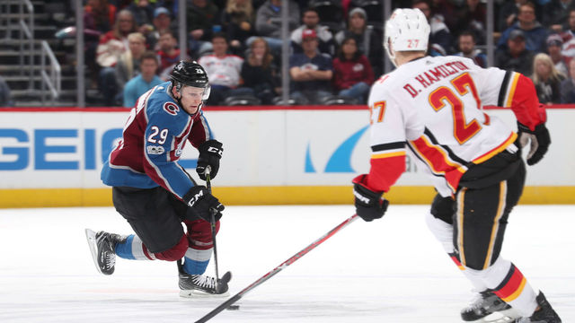 DENVER, CO - NOVEMBER 25: Nathan MacKinnon #29 of the Colorado Avalanche skates against Dougie Hamilton #27 of the Calgary Flames at the Pepsi Center on November 25, 2017 in Denver, Colorado. The Flames defeated the Avalanche 3-2.
