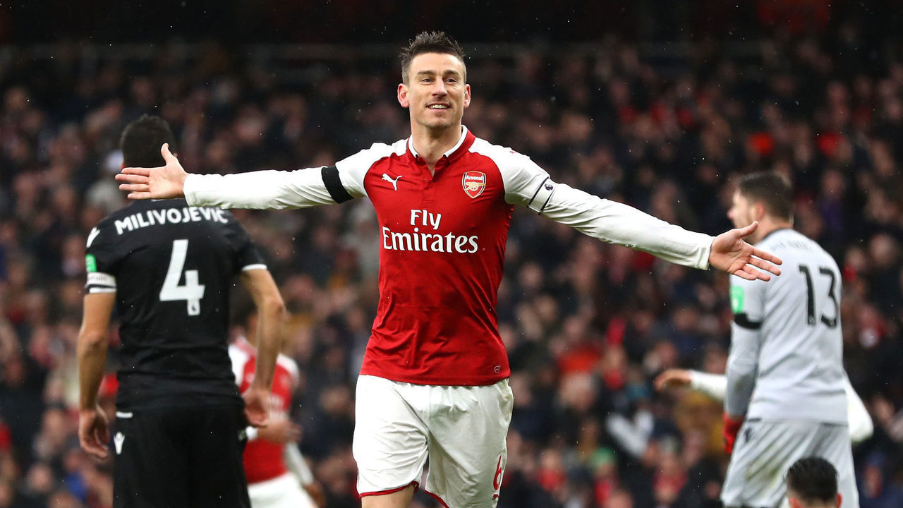 LONDON, ENGLAND - JANUARY 20: Laurent Koscielny of Arsenal celebrates after scoring his sides third goal during the Premier League match between Arsenal and Crystal Palace at Emirates Stadium on January 20, 2018 in London, England.
