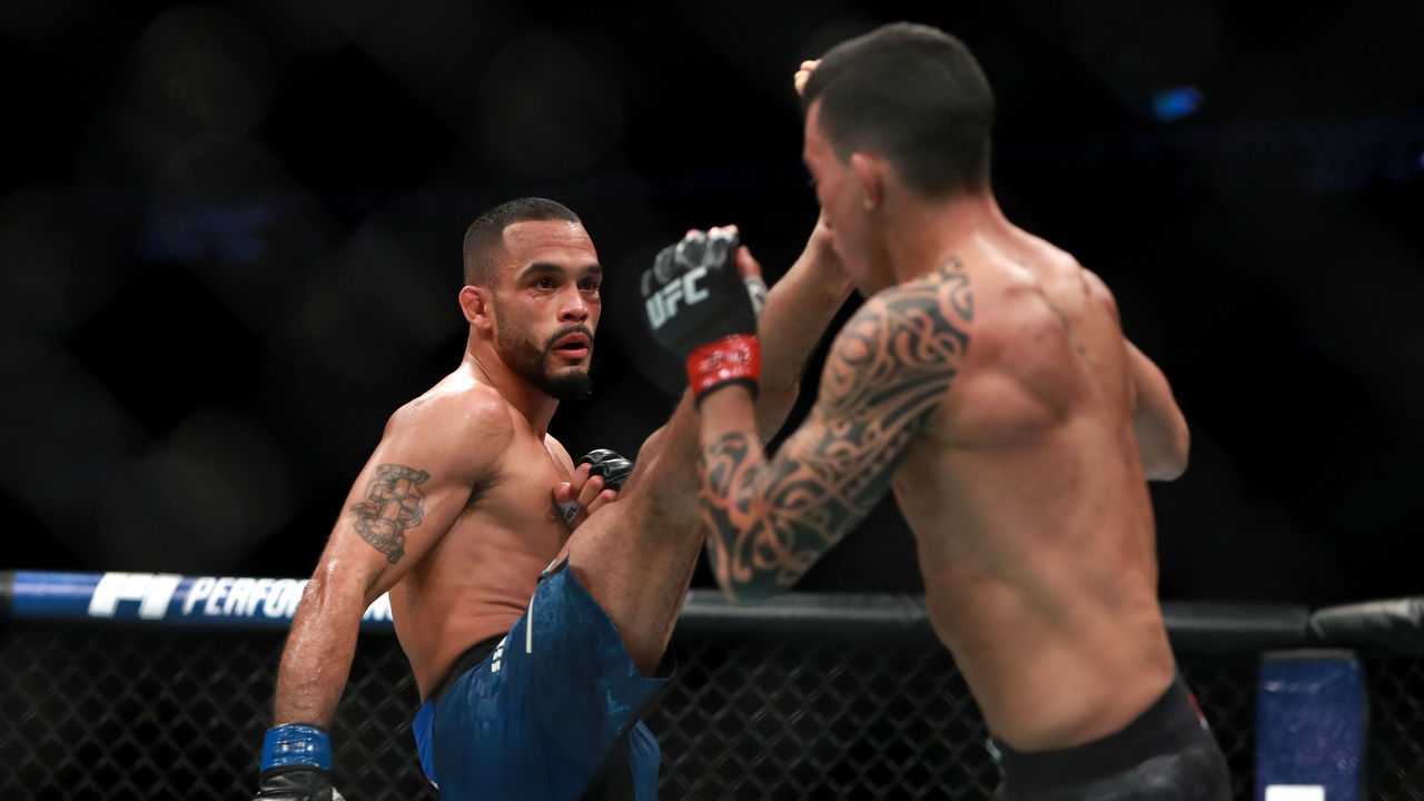 BOSTON, MA - JANUARY 20: Rob Font kicks against Thomas Almeida in their Bantamweight fight during UFC 220 at TD Garden on January 20, 2018 in Boston, Massachusetts.