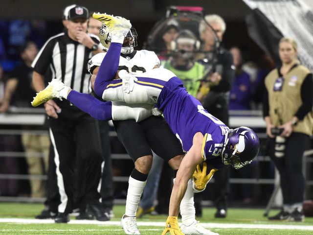 MINNEAPOLIS, MN - JANUARY 14: Adam Thielen #19 of the Minnesota Vikings is flipped upside down after catching the ball in the first half of the NFC Divisional Playoff game against the New Orleans Saints on January 14, 2018 at U.S. Bank Stadium in Minneapolis, Minnesota.