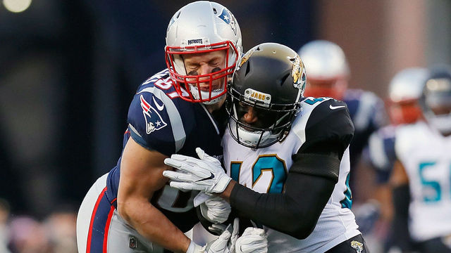 FOXBOROUGH, MA - JANUARY 21: Rob Gronkowski #87 of the New England Patriots is hit by Barry Church #42 of the Jacksonville Jaguars in the second quarter during the AFC Championship Game at Gillette Stadium on January 21, 2018 in Foxborough, Massachusetts.