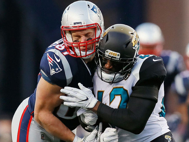 FOXBOROUGH, MA - JANUARY 21: Rob Gronkowski #87 of the New England Patriots is hit by Barry Church #42 of the Jacksonville Jaguars in the second quarter during the AFC Championship Game at Gillette Stadium on January 21, 2018 in Foxborough, Massachusetts.