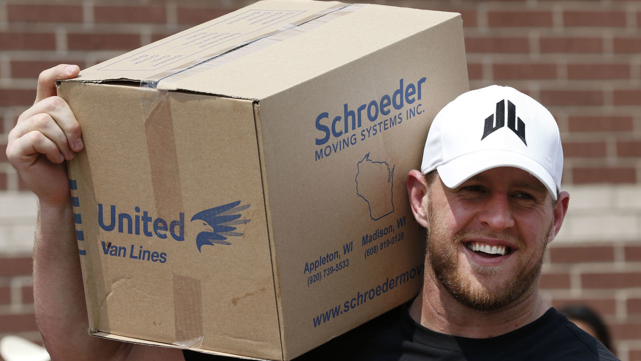 HOUSTON, TX - SEPTEMBER 3: (AFP OUT) Houston Texans defensive end J.J. Watt holds a box of relief supplies on his shoulder while handing them out to people impacted by Hurricane Harvey on September 3, 2017, in Houston, Texas. Watt's Hurricane Harvey Relief Fund has raised more than $18 million to date to help those affected by the storm.