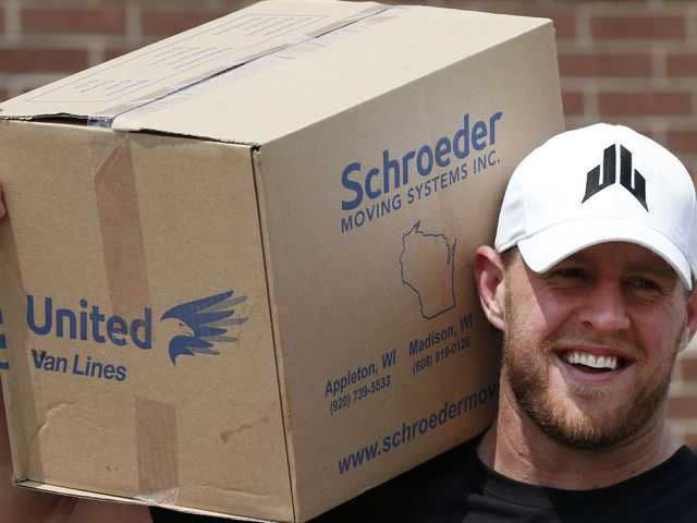 HOUSTON, TX - SEPTEMBER 3: (AFP OUT) Houston Texans defensive end J.J. Watt holds a box of relief supplies on his shoulder while handing them out to people impacted by Hurricane Harvey on September 3, 2017, in Houston, Texas. Watt's Hurricane Harvey Relief Fund has raised more than $18 million to date to help those affected by the storm.