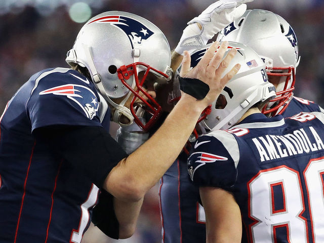 FOXBOROUGH, MA - JANUARY 21: Tom Brady #12 of the New England Patriots celebrates a touchdown with Danny Amendola #80 in the fourth quarter during the AFC Championship Game against the Jacksonville Jaguars at Gillette Stadium on January 21, 2018 in Foxborough, Massachusetts.