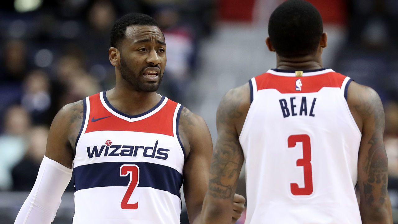 WASHINGTON, DC - DECEMBER 13: John Wall #2 and Bradley Beal #3 of the Washington Wizards talk during the second half against the Memphis Grizzlies at Capital One Arena on December 13, 2017 in Washington, DC.
