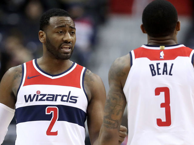 WASHINGTON, DC - DECEMBER 13: John Wall #2 and Bradley Beal #3 of the Washington Wizards talk during the second half against the Memphis Grizzlies at Capital One Arena on December 13, 2017 in Washington, DC.