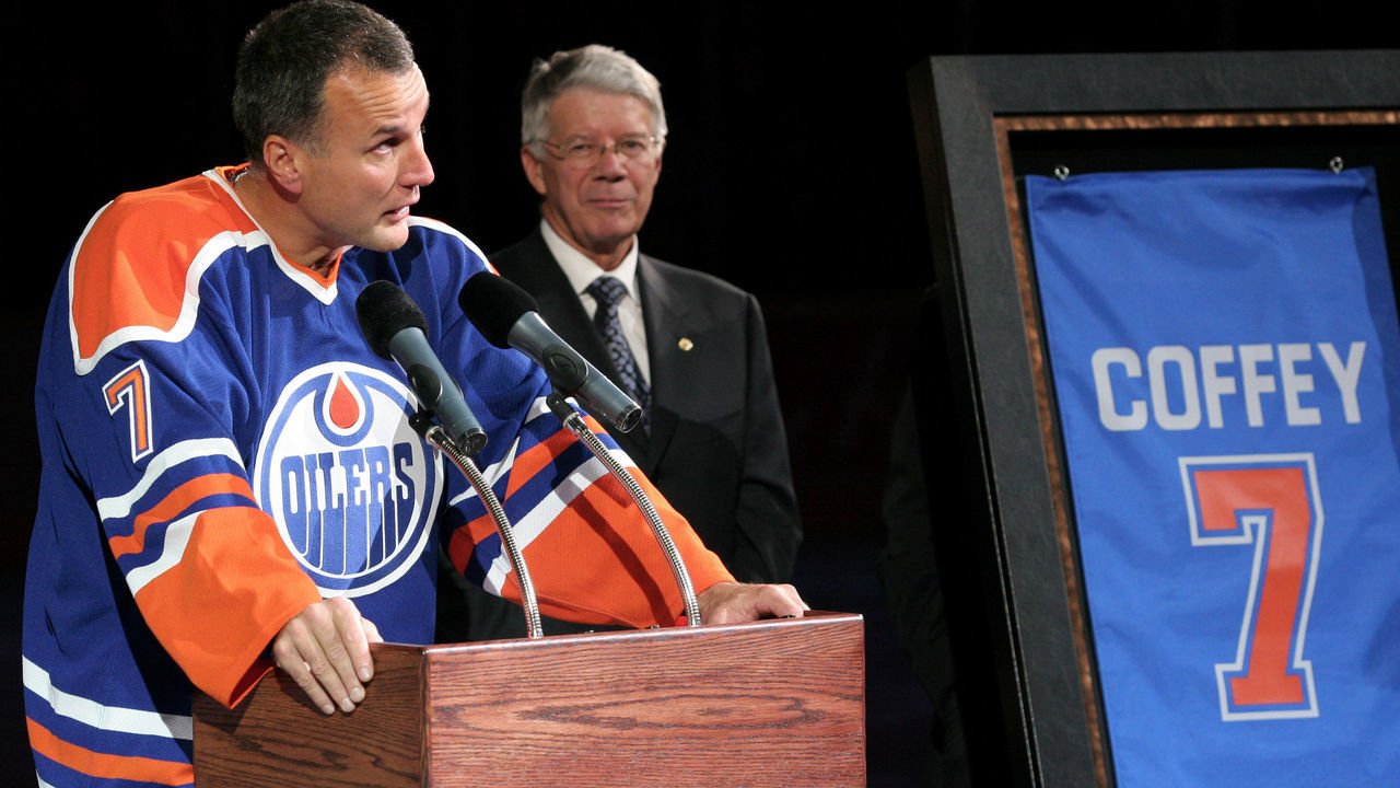 EDMONTON, CANADA - OCTOBER 18: Edmonton Oilers Governor Cal Nichols (R) looks on as Oilers great Paul Coffey delivers a speech before his number 7 retirement banner is raised to the rafters during a special ceremony on October 18, 2005 at Rexall Place in Edmonton, Alberta, Canada.