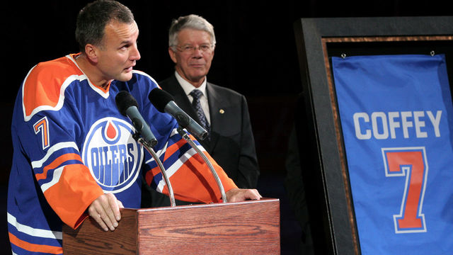 EDMONTON, CANADA - OCTOBER 18: Edmonton Oilers Governor Cal Nichols (R) looks on as Oilers great Paul Coffey delivers a speech before his number 7 retirement banner is raised to the rafters during a special ceremony on October 18, 2005 at Rexall Place in Edmonton, Alberta, Canada.