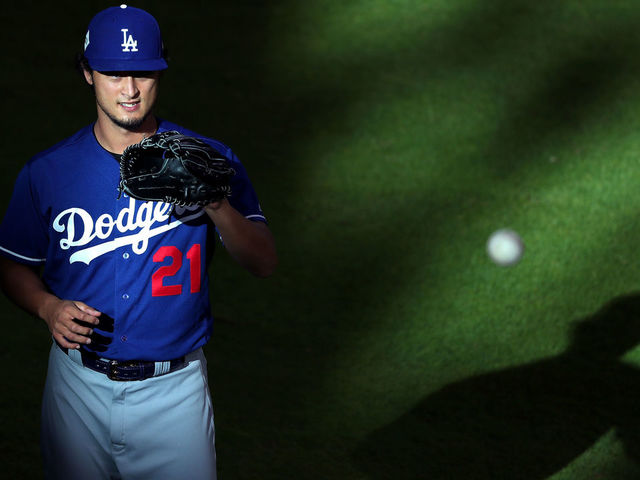 HOUSTON, TX - OCTOBER 29: Yu Darvish #21 of the Los Angeles Dodgers warms up before game five of the 2017 World Series against the Houston Astros at Minute Maid Park on October 29, 2017 in Houston, Texas.