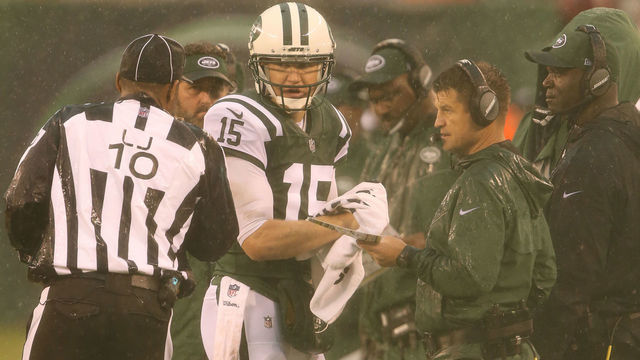 EAST RUTHERFORD, NJ - OCTOBER 29: Quarterback Josh McCown #15 and Quarterbacks Coach Jeremy Bates of the New York Jets in action against the Atlanta Falcons in a heavy rain storm during their game at MetLife Stadium on October 29, 2017 in East Rutherford, New Jersey.