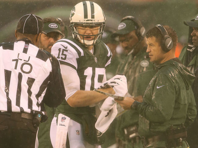 EAST RUTHERFORD, NJ - OCTOBER 29: Quarterback Josh McCown #15 and Quarterbacks Coach Jeremy Bates of the New York Jets in action against the Atlanta Falcons in a heavy rain storm during their game at MetLife Stadium on October 29, 2017 in East Rutherford, New Jersey.