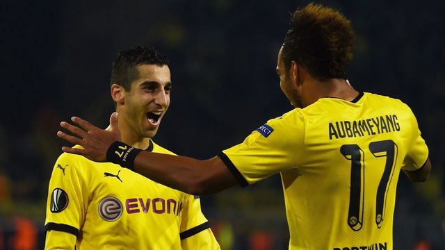 Dortmund's Gabonese striker Pierre-Emerick Aubameyang (R) celebrates scoring with Armenian midfielder Henrikh Mkhitaryan during the UEFA Europa League football match Borussia Dortmund vs Qabala FK, in Dortmund, western Germany on November 5, 2015. AFP PHOTO / PATRIK STOLLARZ