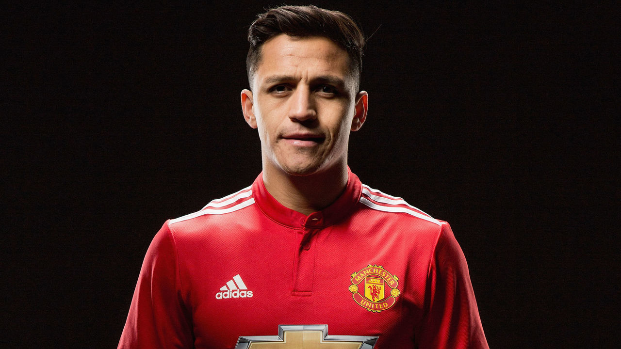 MANCHESTER, ENGLAND - JANUARY 22: (EXCLUSIVE COVERAGE) Alexis Sanchez of Manchester United poses after signing for the club at Old Trafford on January 22, 2018 in Manchester, England.