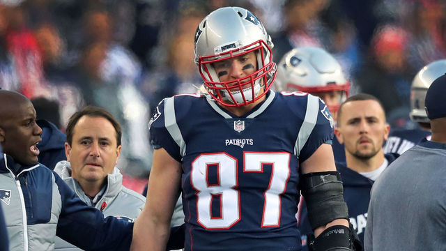 FOXBOROUGH, MA - JANUARY 21: New England Patriots tight end Rob Gronkowski is escorted to the locker room after being hit in the head on a play late in the second quarter. The New England Patriots host the Jacksonville Jaguars in an NFL AFC championship game at Gillette Stadium in Foxborough, MA on Jan. 21, 2018.