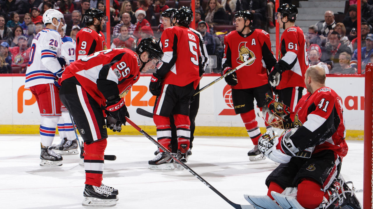 OTTAWA, ON - DECEMBER 13: Craig Anderson #41 of the Ottawa Senators looks at the referee after getting his mask knocked off during a play at the net against the New York Rangers as teammate Matt Duchene #95 skates toward him at Canadian Tire Centre on December 13, 2017 in Ottawa, Ontario, Canada.