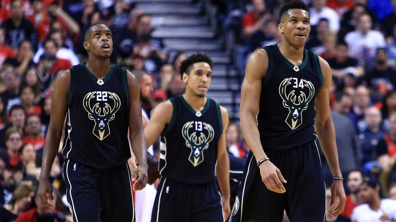 TORONTO, ON - APRIL 15: Khris Middleton #22, Malcolm Brogdon #13 and Giannis Antetokounmpo #34 of the Milwaukee Bucks look on in the second half of Game One of the Eastern Conference Quarterfinals against the Toronto Raptors during the 2017 NBA Playoffs at Air Canada Centre on April 15, 2017 in Toronto, Canada.