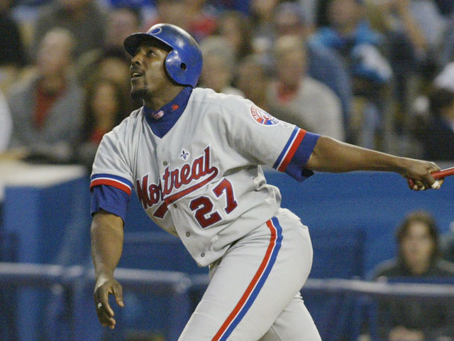 LOS ANGELES - MAY 17: Right fielder Vladimir Guerrero #27 of the Montreal Expos watches the flight of the ball during the MLB game against the Los Angeles Dodgers at Dodger Stadium in Los Angeles, California on May 19, 2002. The Dodgers won 8-5.